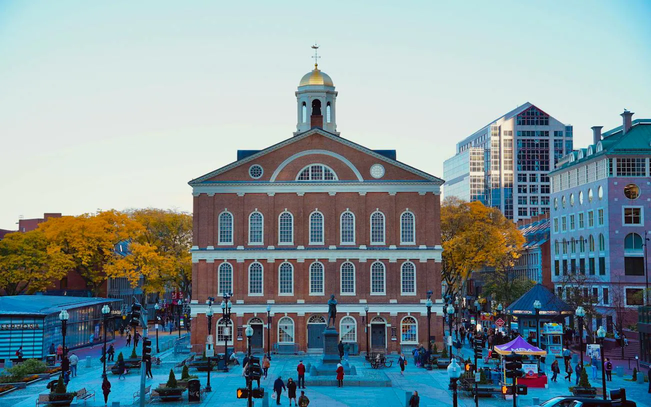 Faneuil Hall on the Boston Freedom Trail, bustling with visitors on a self-guided audio walking tour.