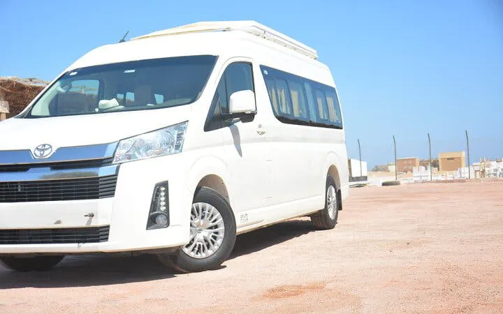 White minivan for personalized airport transfer service in Hurghada.