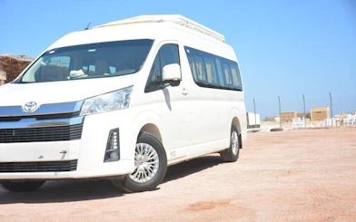 White minivan for personalized airport transfer service in Hurghada.