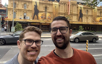 Melbourne theater with Hamilton banners, part of Ghosts of Melbourne city exploration game.