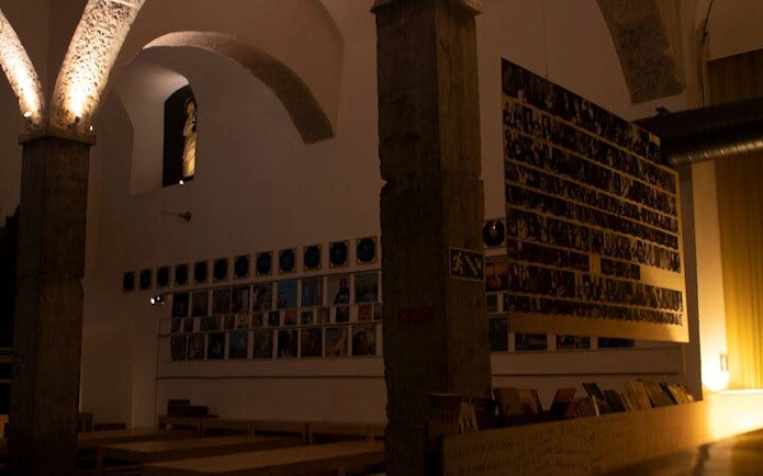 Historic Roman theatre interior in Lisbon set for Portuguese dinner and Fado concert.