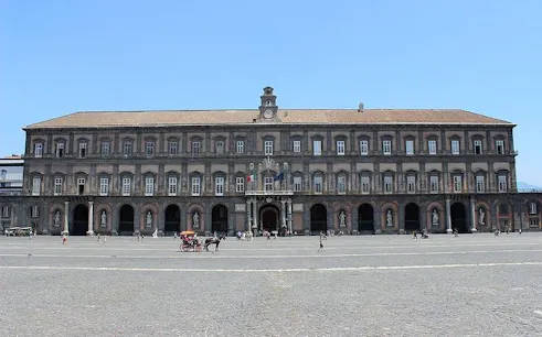 Royal Palace of Naples facade with entrance and courtyard.