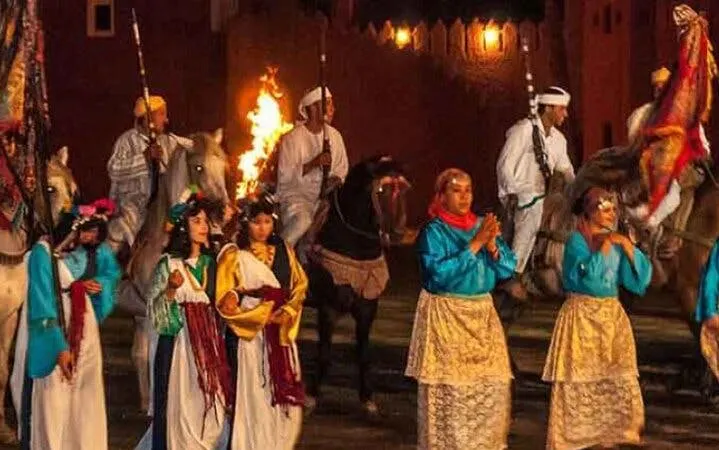 Performers in traditional attire at Chez Ali Folklore Show, Marrakesh.