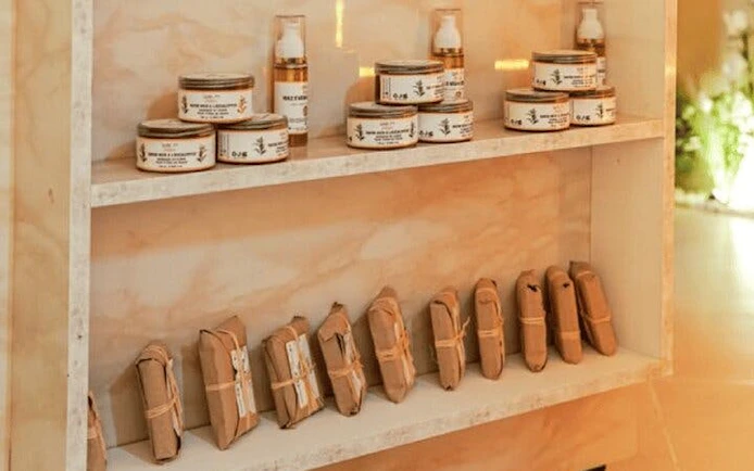 Luxury Moroccan hammam products on display shelf in Marrakesh spa.