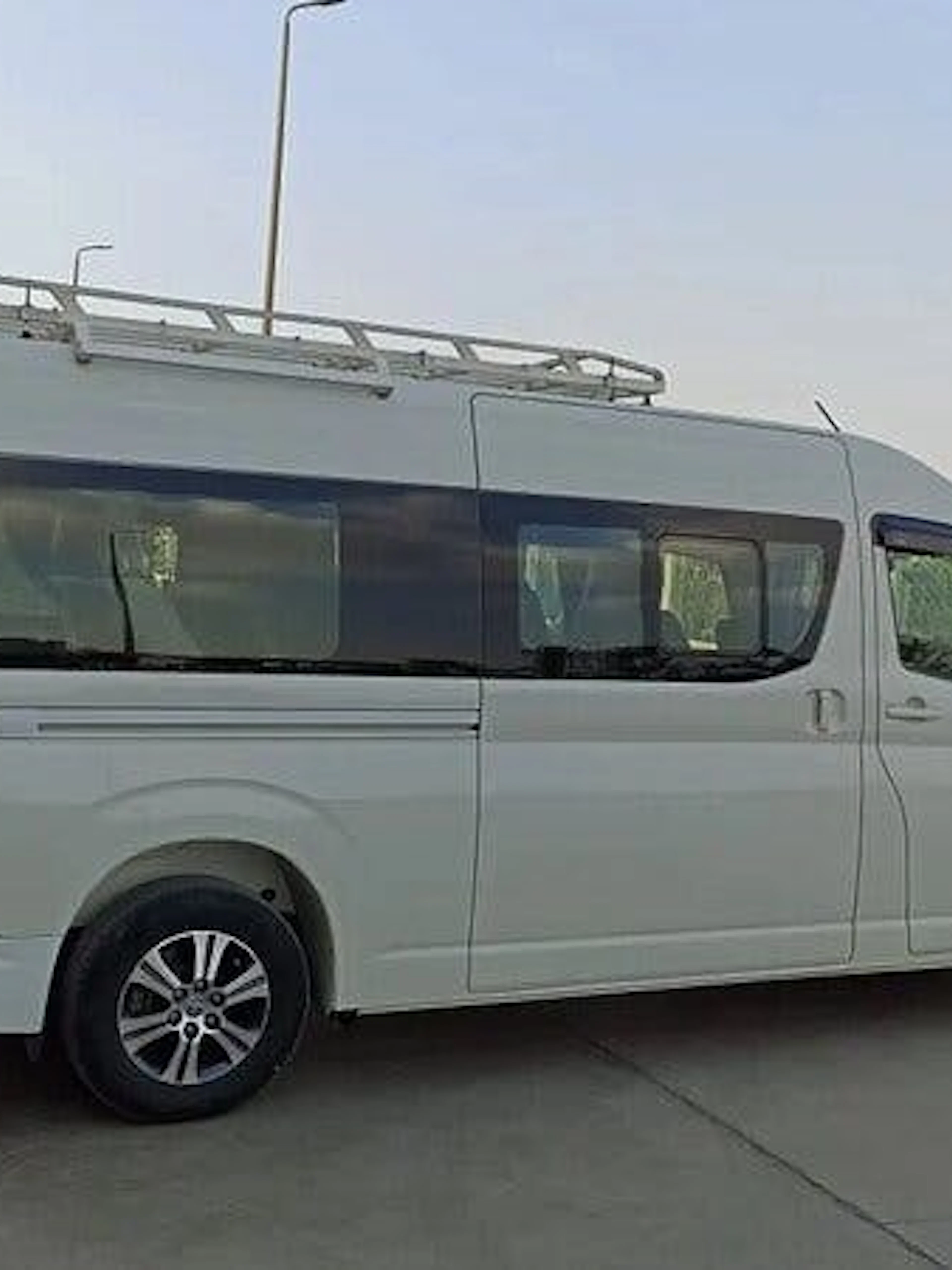 Van for personalized airport transfer service in Hurghada, parked near hotel.