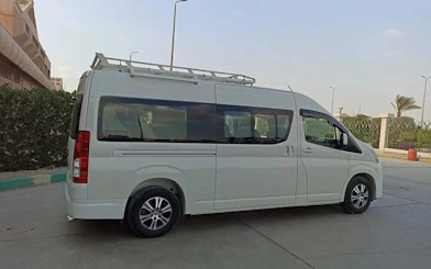 Van for personalized airport transfer service in Hurghada, parked near hotel.