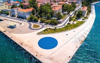 Zadar waterfront with solar installation and coastal promenade, Croatia.