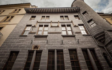 Historic building facade in Geneva, part of the self-guided city exploration game.