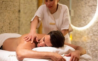 Massage therapist giving a back massage at a Turkish bath in Hurghada.