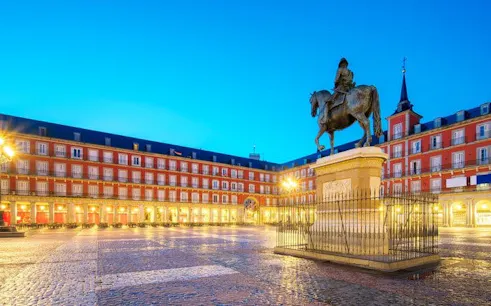Plaza Mayor statue and surrounding architecture in Madrid during a self-guided walking tour.