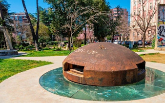 Tirana bunker in a park setting, part of a self-guided walking tour.
