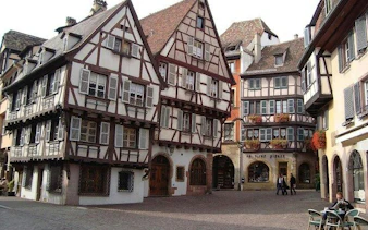Half-timbered houses in Colmar's historic district during Alsace Christmas Markets day trip.