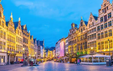 Antwerp city square with historic buildings during evening, part of self-guided walking tour.