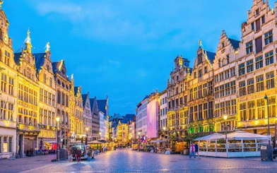 Antwerp city square with historic buildings during evening, part of self-guided walking tour.