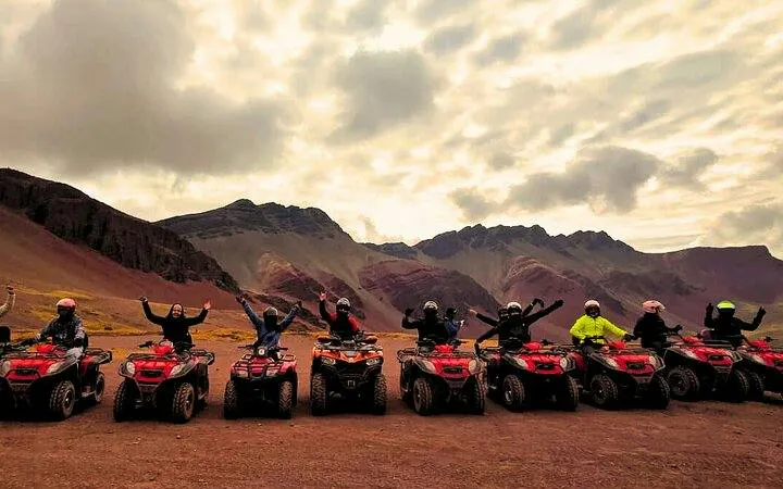 ATV riders in front of Rainbow Mountain and Red Valley, Cusco.