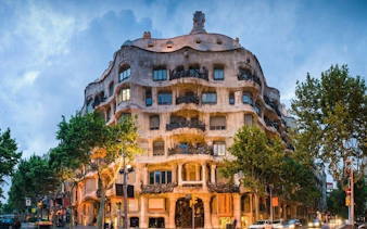 Casa Milà facade in Barcelona, featured on a self-guided walking tour mobile app.