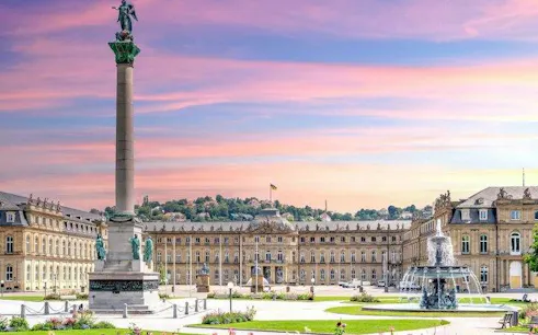 Schlossplatz with Jubilee Column and fountain in Stuttgart during sunset.