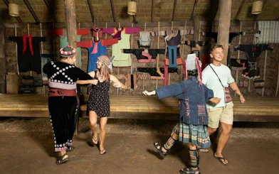 Traditional dance performance at Siam Niramit Phuket with participants in cultural attire.