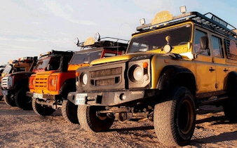Cappadocia Jeep Safari vehicles lined up for a tour with hotel pickup.