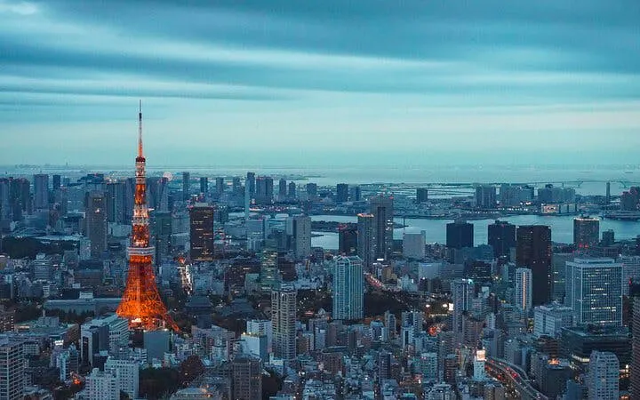 Tokyo skyline with illuminated Tokyo Tower at dusk, viewed from the Tokyo City View Observation Deck.