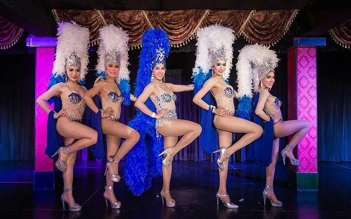 Cabaret performers in elaborate costumes on stage at Blue Dragon Cabaret, Krabi.