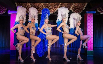 Cabaret performers in elaborate costumes on stage at Blue Dragon Cabaret, Krabi.