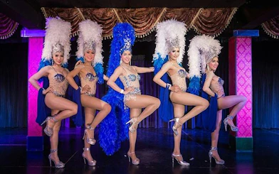Cabaret performers in elaborate costumes on stage at Blue Dragon Cabaret, Krabi.
