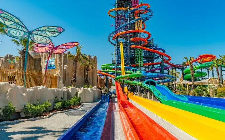 Colorful water slides and butterfly sculptures at The Land of Legends Theme Park, Turkey.