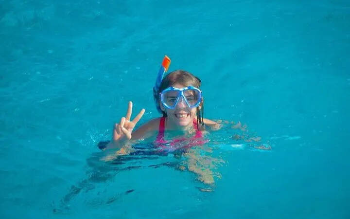 Snorkeler enjoying the water during a private speedboat ride in Sharm El Sheikh.