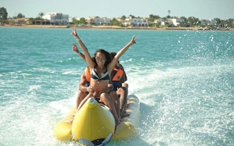 People enjoying a banana boat ride on the sea in Sharm El Sheikh.