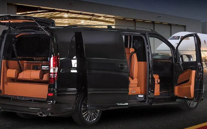 Modern black van with open doors at Istanbul airport for private transfer.