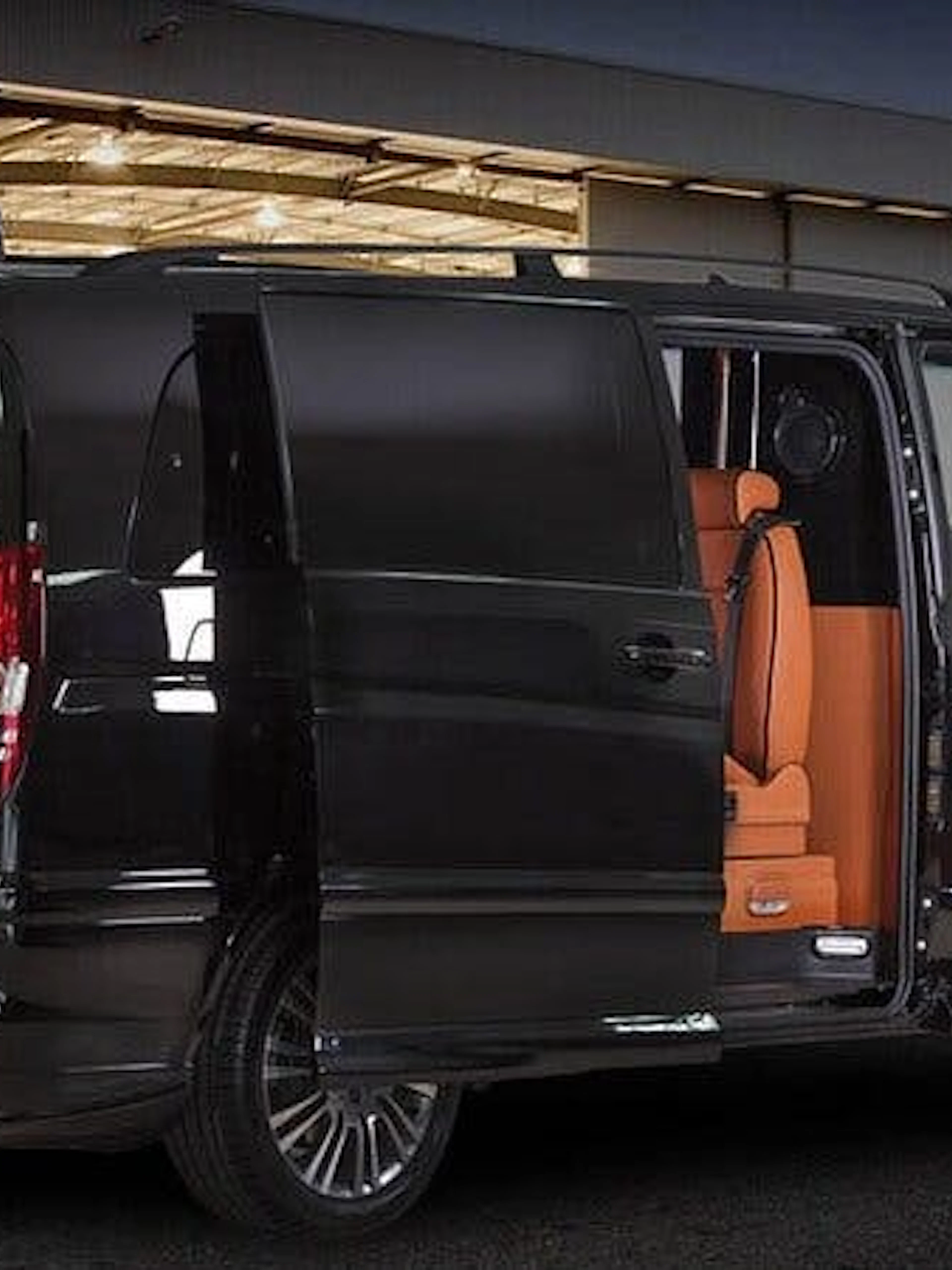 Modern black van with open doors at Istanbul airport for private transfer.