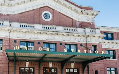 Union Station facade in Seattle, part of the Gold Rush city exploration game.