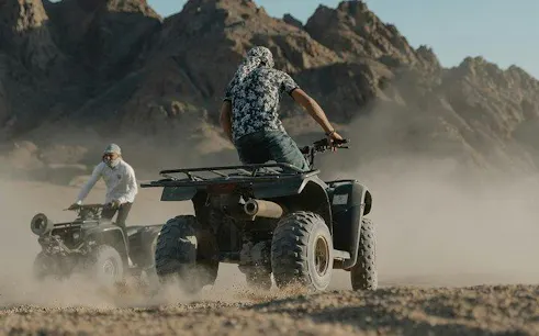 ATV riders exploring desert terrain in Sharm El Sheikh.