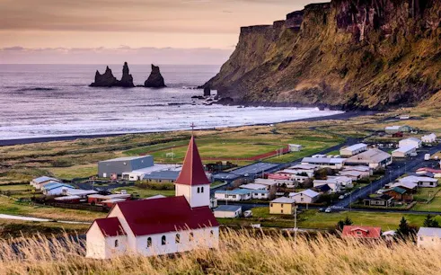 Vik village with Reynisdrangar sea stacks and church, Iceland self-guided walking tour.