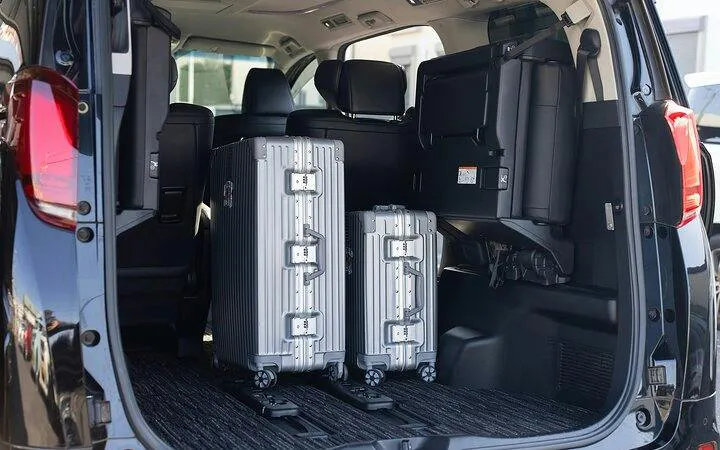 Luggage in the trunk of a private transfer vehicle, Osaka City to Kansai Airport.