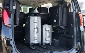 Luggage in the trunk of a private transfer vehicle, Osaka City to Kansai Airport.