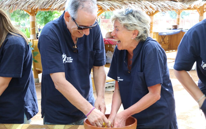 Feeding preparation at Samui Elephant Home Nursery with participants.