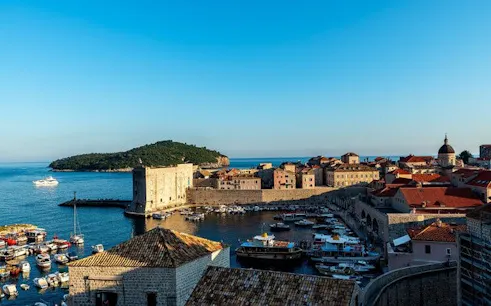 Old Town Split harbor view with boats and historic buildings, Croatia.