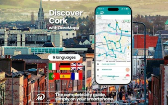 Smartphone displaying Cork city guide app with map, set against a cityscape background.