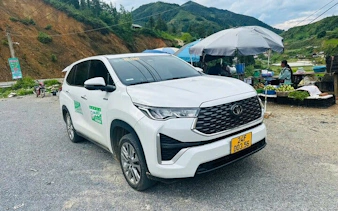 Private car parked near roadside market, available for flexible half-day museum tours.