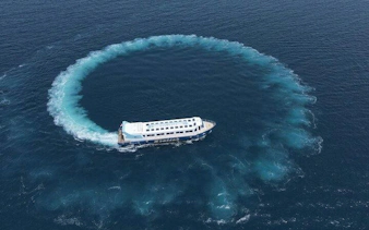 Panorama semi-submarine creating a circular wake in the sea, Hurghada.