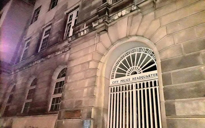 Old City Police Headquarters in Manchester at night, part of the Haunted Manchester exploration game.