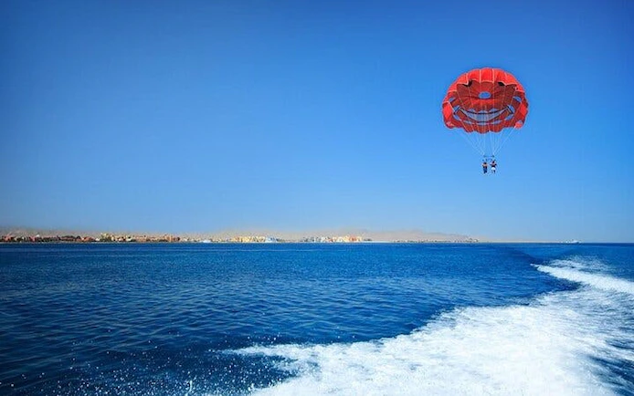 Parasailing over the Red Sea with a speedboat in Hurghada, Egypt.