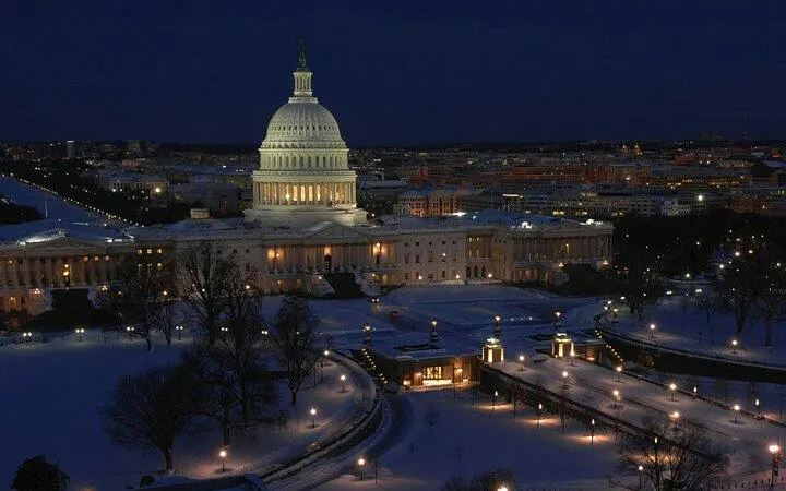 U.S. Capitol building illuminated at night, Washington DC, part of self-guided city exploration game.