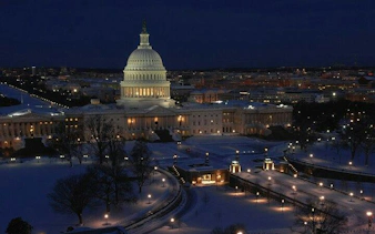 U.S. Capitol building illuminated at night, Washington DC, part of self-guided city exploration game.