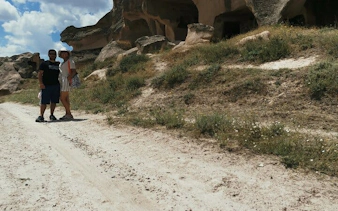 Trekking path with rock formations in Cappadocia's scenic valleys.