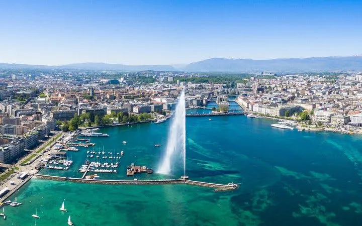 Aerial view of Jet d'Eau fountain in Lake Geneva during self-guided walking tour.