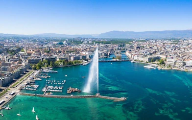 Aerial view of Jet d'Eau fountain in Lake Geneva during self-guided walking tour.
