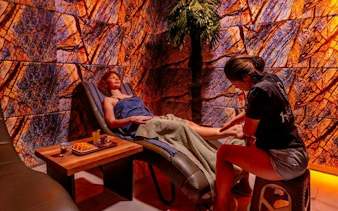 Woman receiving leg massage during Turkish bath ritual at Alanya Hamam, Alanya.